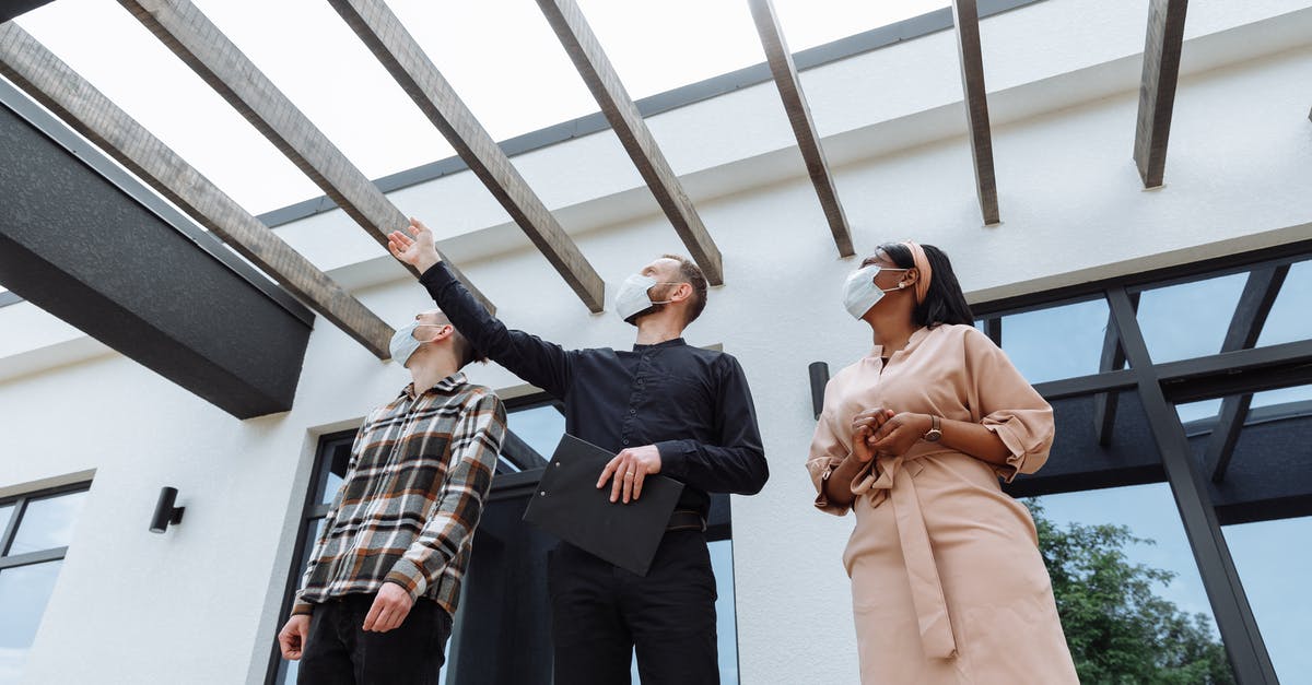 Why was this border agent rude to me? - Man and Woman Standing on a Building Why was this border agent rude to me? - Man and Woman Standing on a Building