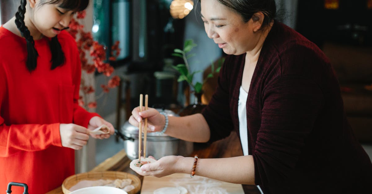 Wife is a Chinese Citizen I am a US Citizen, should we go through Chinese passport control together or separately? - Crop teenage Asian girl with dark hair helping grandmother to fold traditional Chinese jiaozi dumplings while cooking together in kitchen Wife is a Chinese Citizen I am a US Citizen, should we go through Chinese passport control together or separately? - Crop teenage Asian girl with dark hair helping grandmother to fold traditional Chinese jiaozi dumplings while cooking together in kitchen