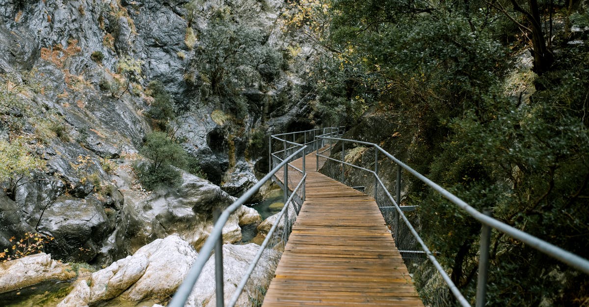 WildLife Tourist Destination in France - Small footbridge over river in mountainous terrain WildLife Tourist Destination in France - Small footbridge over river in mountainous terrain