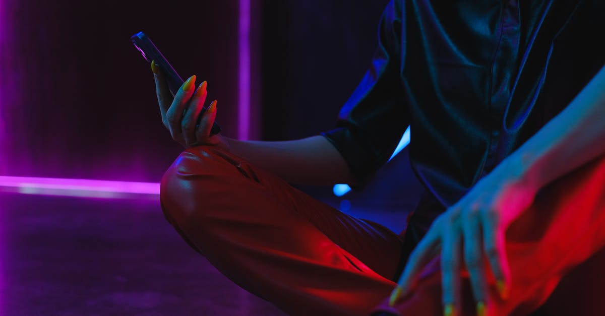 Will 6 months on a visitor visa affect an application for a Youth Mobility Scheme Visa? [closed] - Crop unrecognizable woman using smartphone on studio floor