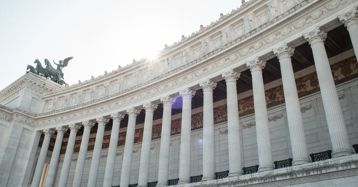 Will a Schengen visa refusal affect my border entry to Italy on an Italian national visa? - From below of majestic columns of Altare della Patria in Rome on sunny day