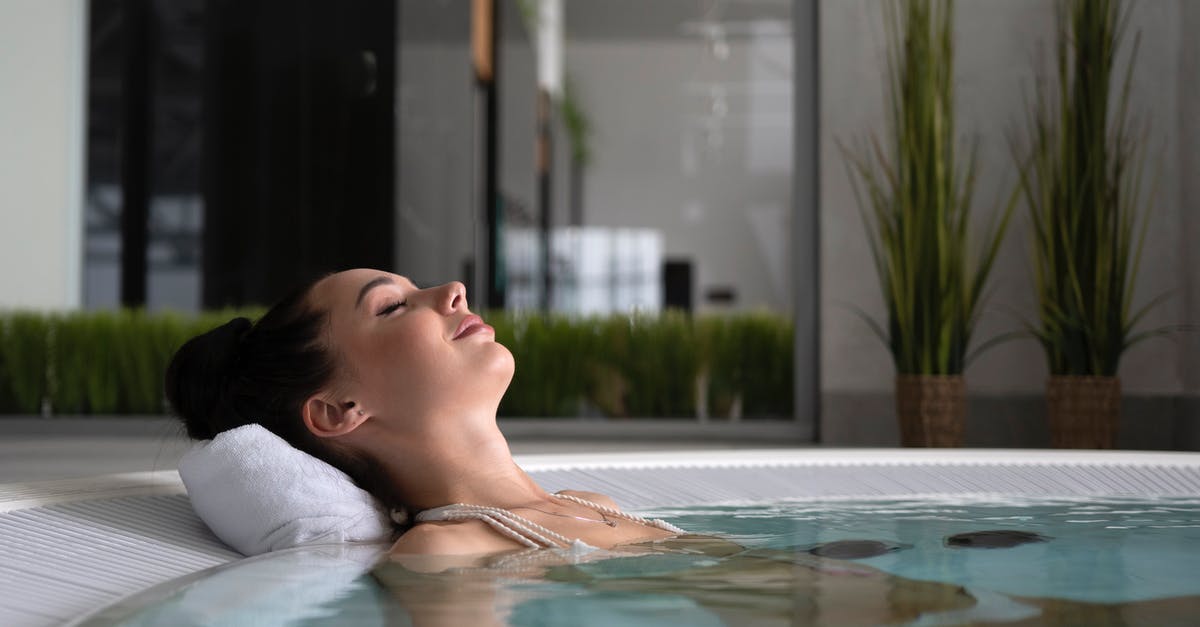 Will Bárðarbunga threaten my vacation? [closed] - Woman in White Shirt Swimming on Pool