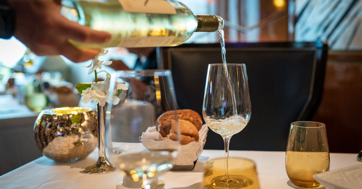 Will bringing your own bottle of wine to a restaurant in France cause bad service? - Wine Bottle Pouring on Wine Glass Will bringing your own bottle of wine to a restaurant in France cause bad service? - Wine Bottle Pouring on Wine Glass