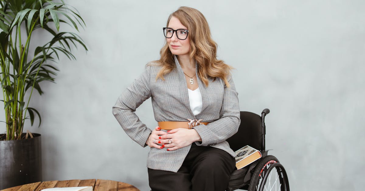 Will connecting my wallet to my belt loop deter or attract pickpockets? - Woman in Gray Blazer Sitting on Brown Wooden Chair Will connecting my wallet to my belt loop deter or attract pickpockets? - Woman in Gray Blazer Sitting on Brown Wooden Chair