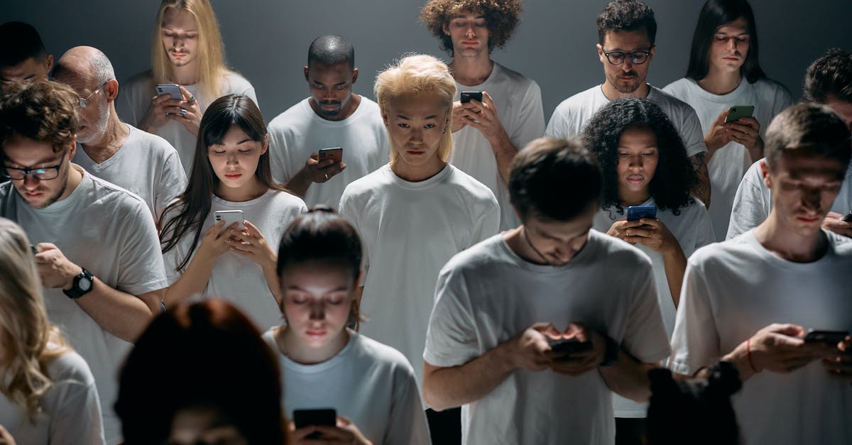 Will getting refused on a Diversity Visa application complicate my future entries to the United States? - Group of People in White Shirts
