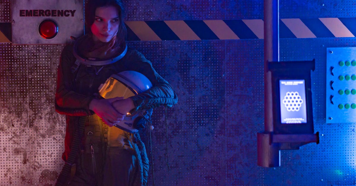 Will I be eligible for an Emergency Travel Document? - Woman In Spacesuit Standing Near An Emergency Sign Will I be eligible for an Emergency Travel Document? - Woman In Spacesuit Standing Near An Emergency Sign