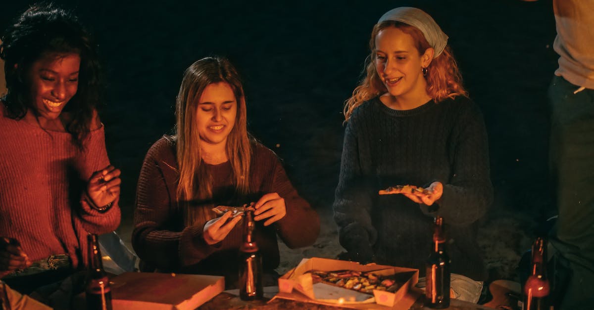Will I get in trouble if I drink beer in public in Dubai? - Three Women Eating Pizza Will I get in trouble if I drink beer in public in Dubai? - Three Women Eating Pizza