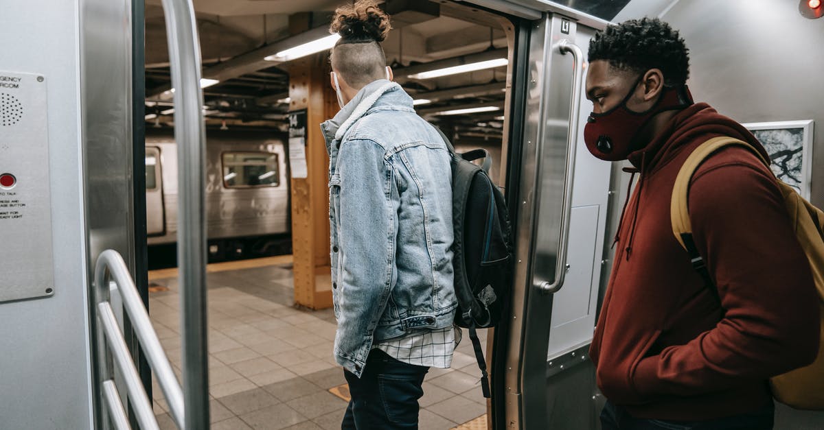 Will I get refund if train was cancelled - Anonymous diverse passengers with rucksacks getting off subway Will I get refund if train was cancelled - Anonymous diverse passengers with rucksacks getting off subway