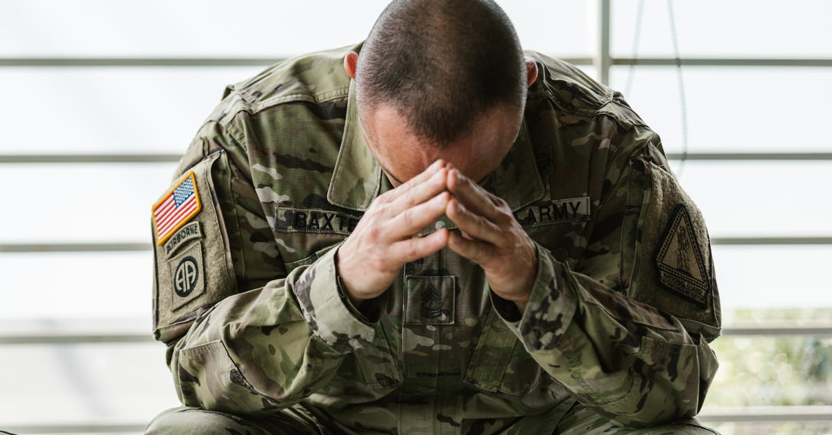 Will I have a problem re-entering the United States? - Photo of Man in Military Uniform Will I have a problem re-entering the United States? - Photo of Man in Military Uniform