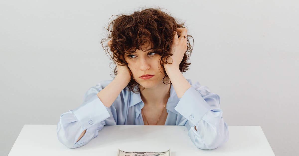 Will I have a problem re-entering the United States? - Woman in Blue Long Sleeve Blouse Near the Money on Table Will I have a problem re-entering the United States? - Woman in Blue Long Sleeve Blouse Near the Money on Table