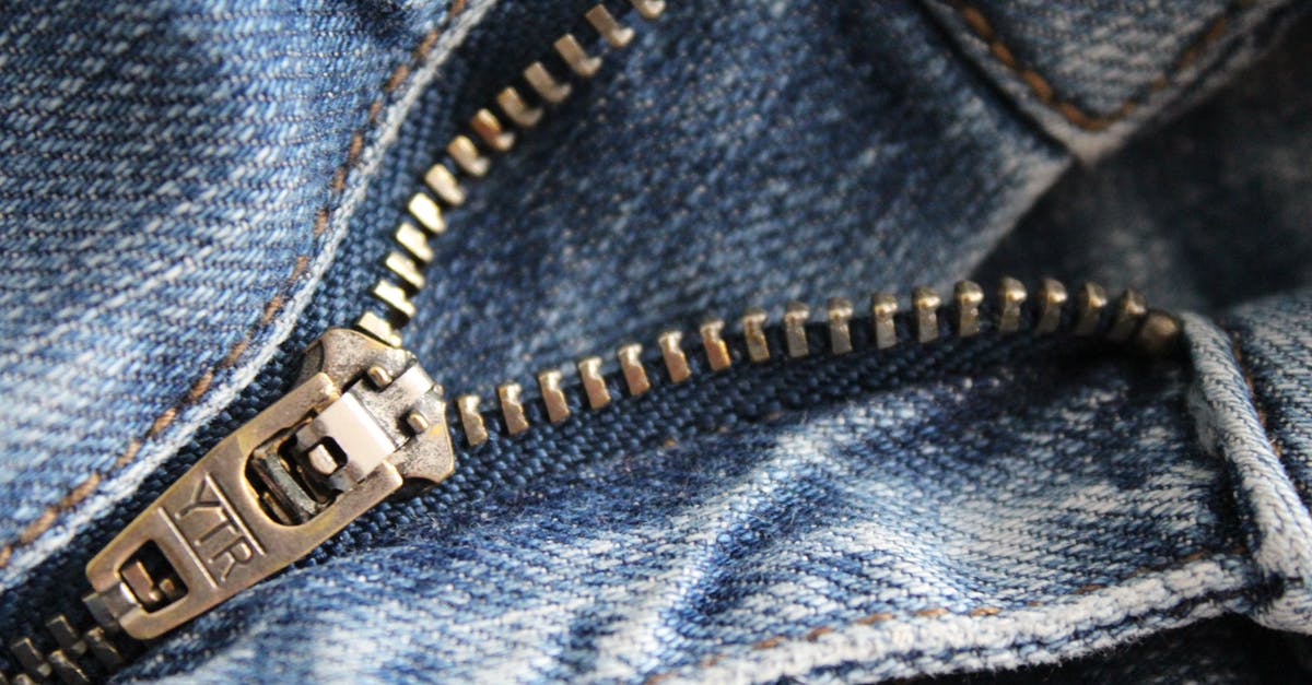 Will I pass through airport security screening wearing trousers and a jacket with metal zippers/buttons - Close Up of Zipper of Blue Denim Bottoms Will I pass through airport security screening wearing trousers and a jacket with metal zippers/buttons - Close Up of Zipper of Blue Denim Bottoms