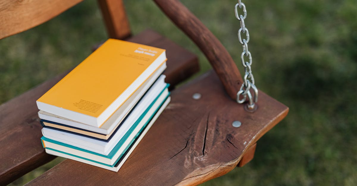 Will knowledge of Yiddish be useful traveling in Israel? - From above of pile of colorful books on wooden bench of garden swing on quiet summer evening Will knowledge of Yiddish be useful traveling in Israel? - From above of pile of colorful books on wooden bench of garden swing on quiet summer evening