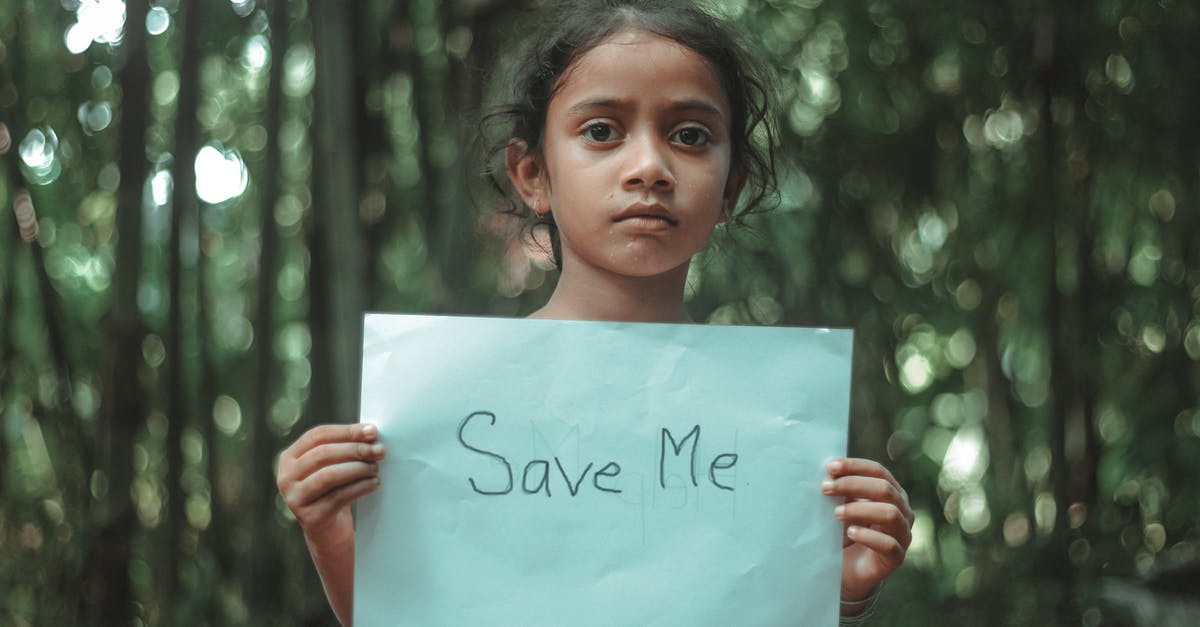 Will mention of a previously undisclosed relative, who will now invite me to the UK, help me to obtain a visa? [closed] - Girl Holding a Blue Paper