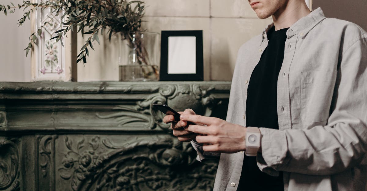 Will my AT&T iPhone 5 work in the UK? - Man in Gray Suit Jacket Holding Black Airsoft Pistol Will my AT&T iPhone 5 work in the UK? - Man in Gray Suit Jacket Holding Black Airsoft Pistol