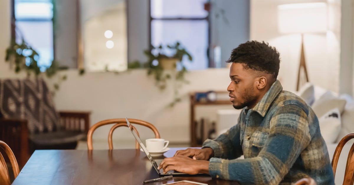 Will my both type C and type D schengen visa be valid if I travel using one of them? [closed] - Concentrated black man working on laptop at home office