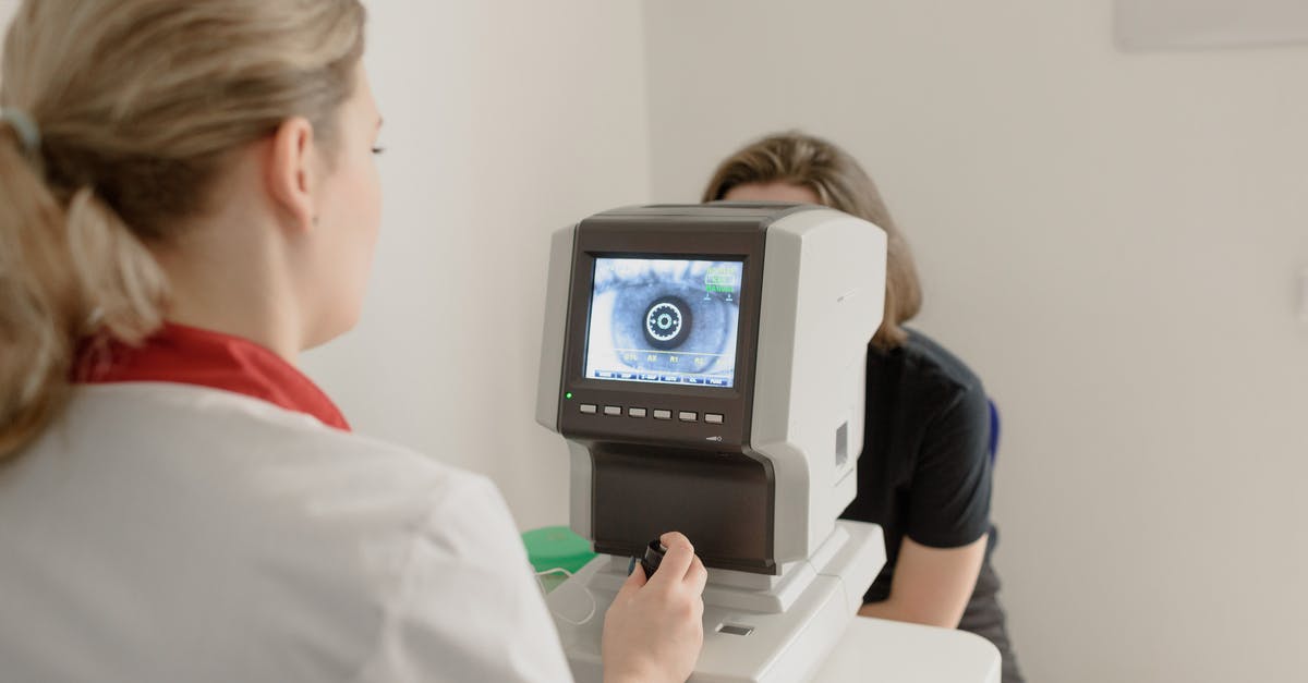 Will my ID scan at check-in? - Anonymous oculist examining vision of patient on eye screener Will my ID scan at check-in? - Anonymous oculist examining vision of patient on eye screener