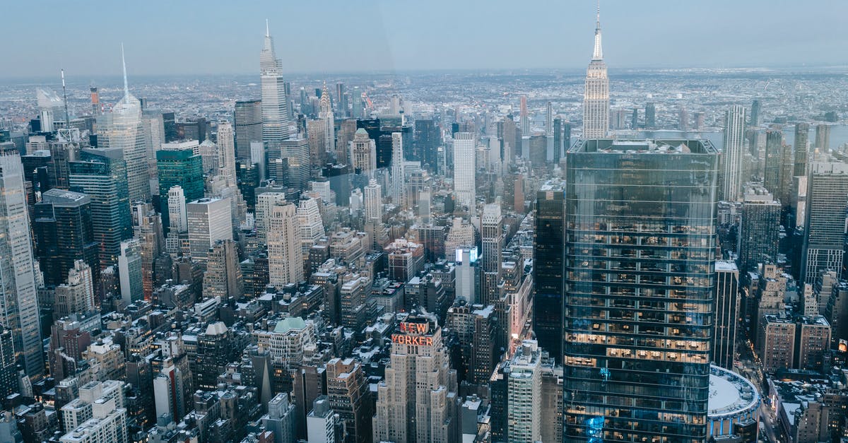 Will my USA iPhone work outside the USA? - Drone view of modern high rise buildings and residential houses located on street of New York City against cloudless sky Will my USA iPhone work outside the USA? - Drone view of modern high rise buildings and residential houses located on street of New York City against cloudless sky