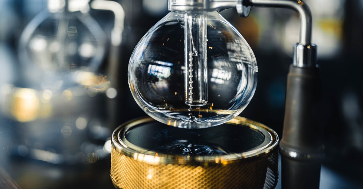 Will retort vacuum sealed canning bags pass metal detector, TSA allowed? - Professional vacuum coffeemaker with glass bottom bowl and burner placed on table in modern coffee house with equipment on blurred background