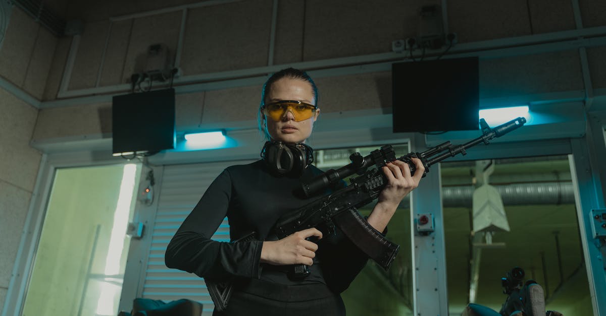Will the wearing of a silicone butt plug be detected by Security? [closed] - Man in Black Jacket Holding Black Rifle