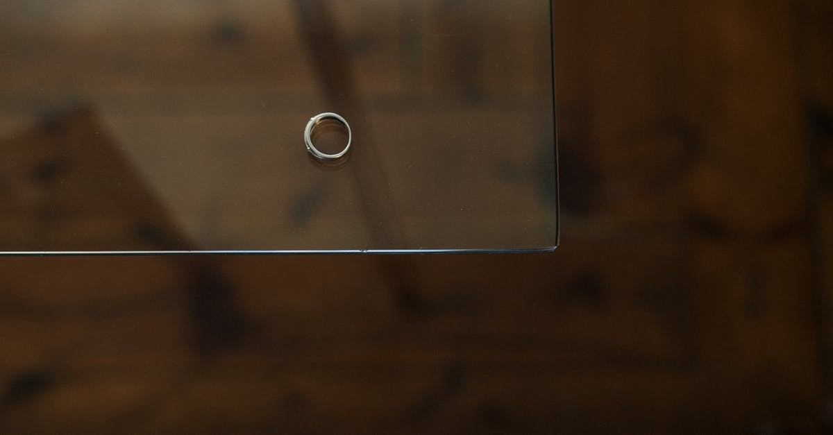 Will this become a problem for remaining in the UK once married? [closed] - Silver Ring on Brown Wooden Table