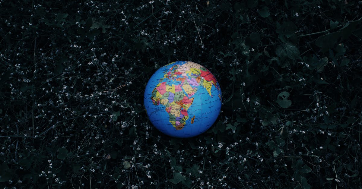 Will this small crease in passport be a problem - Earth globe placed on dark grass Will this small crease in passport be a problem - Earth globe placed on dark grass