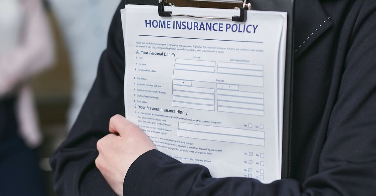 Wizz Air insurance policy - Person Holding Insurance Policy Contract Wizz Air insurance policy - Person Holding Insurance Policy Contract