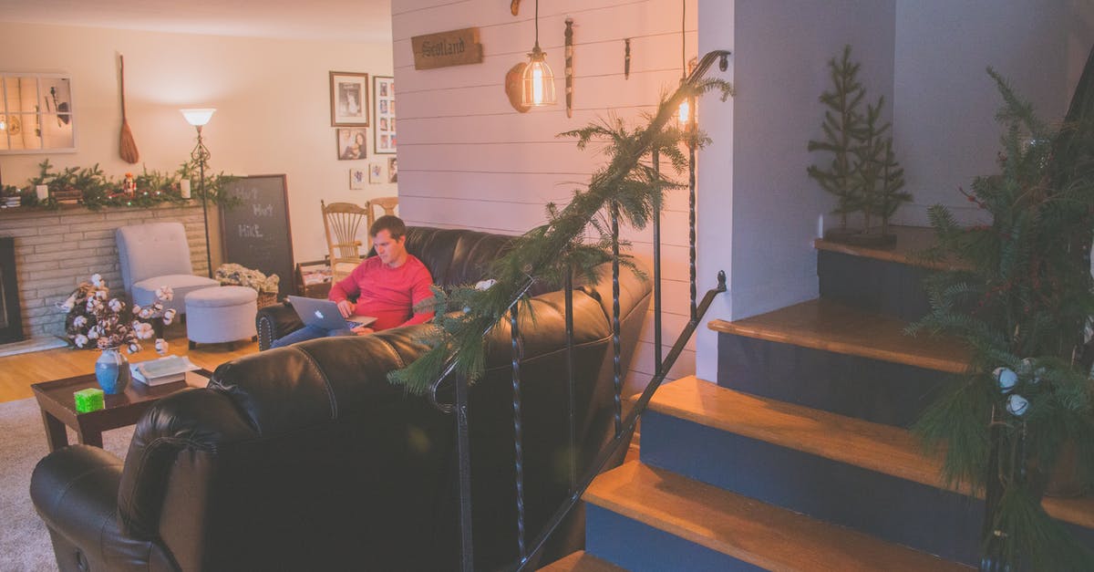 Working remotely on the French work and holiday visa? - Man Using Silver Macbook While Sitting on Black Corner Sofa Working remotely on the French work and holiday visa? - Man Using Silver Macbook While Sitting on Black Corner Sofa