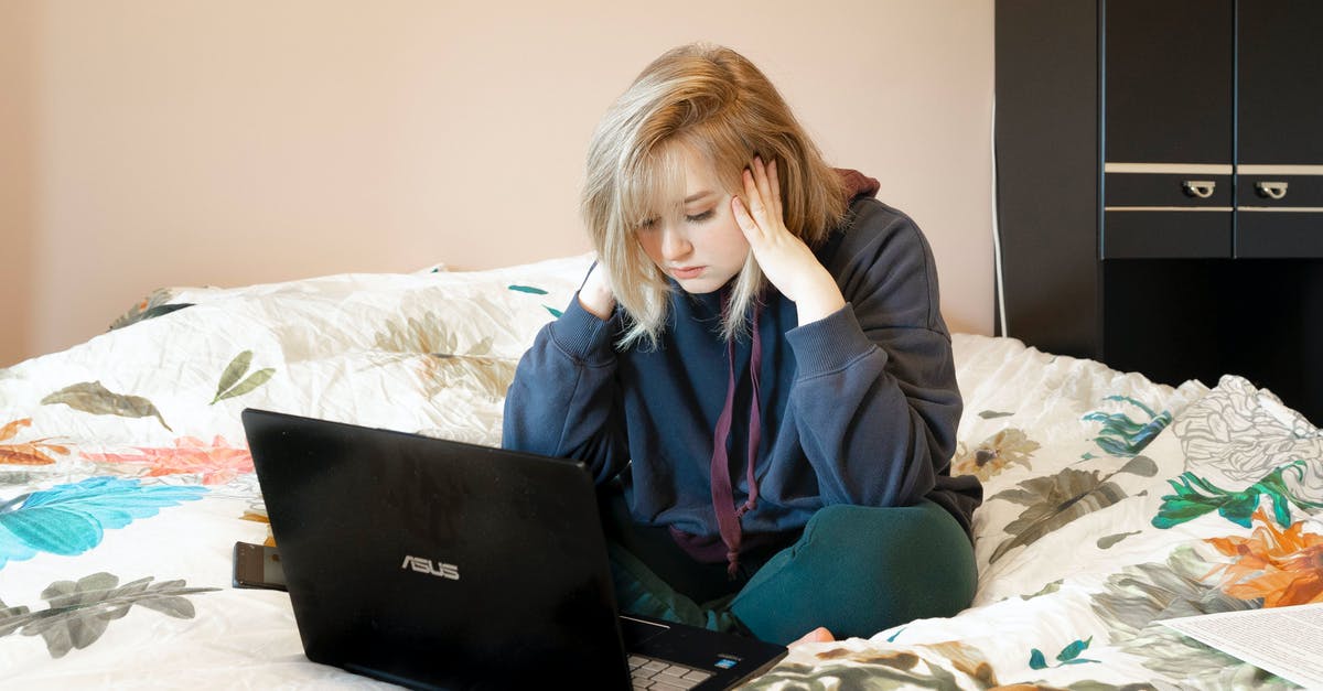 Working with J1 SSN on B1-B2 visa, questions about possible problems [closed] - Woman in Blue Hoodie Sitting on Bed Using Black Laptop Computer