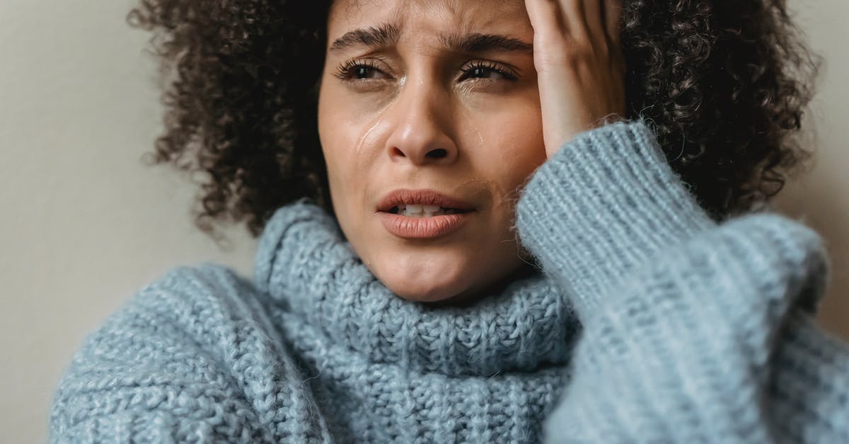 Worried about short layovers - Sad black female crying and looking away Worried about short layovers - Sad black female crying and looking away