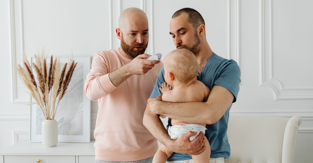 Worried that my parents information might not match - Two Men Checking The Body Temperature Of Baby