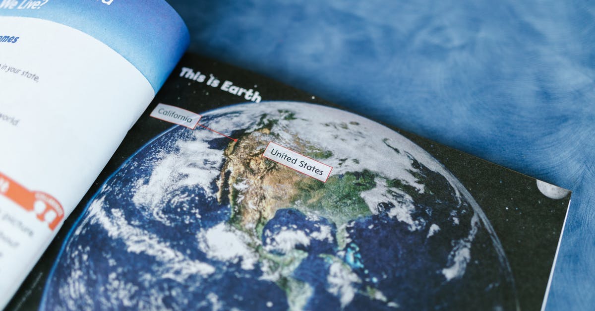 Would a photo of my passport pages be considered valid ID if I lose my passport? - Open Book with a Photo of Earth