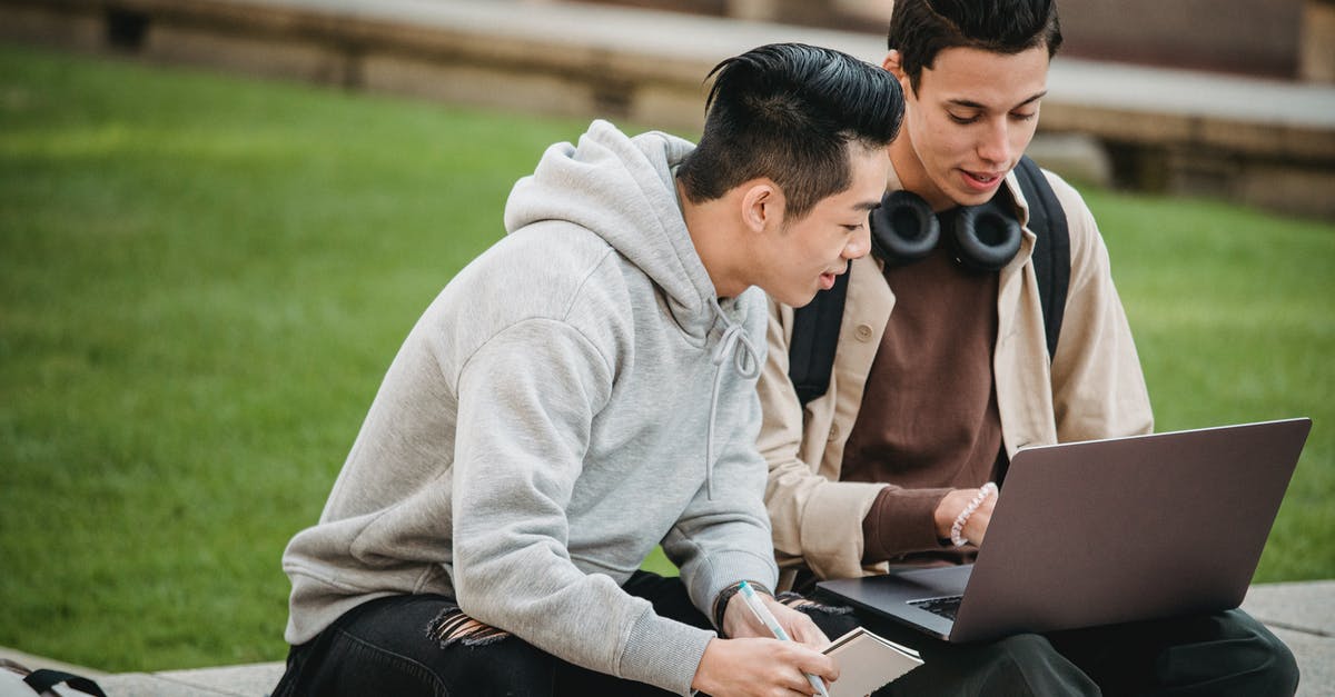 Would I save much time by applying for an I-94 online before arriving to a land border? - Young multiethnic male students in casual outfit sitting on stone border near green grass while using with computer and notebook in city street in daylight Would I save much time by applying for an I-94 online before arriving to a land border? - Young multiethnic male students in casual outfit sitting on stone border near green grass while using with computer and notebook in city street in daylight