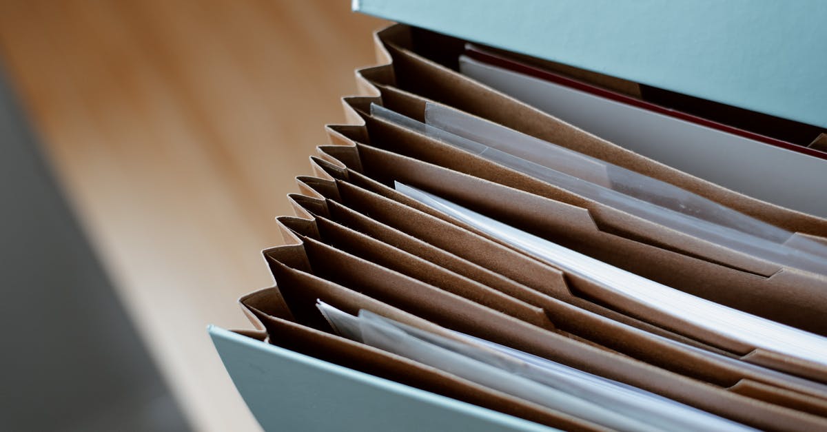 Would my fingerprints still be on file from a 2013 application? - High angle of opened briefcase for documents with papers accosted in order placed on wooden table Would my fingerprints still be on file from a 2013 application? - High angle of opened briefcase for documents with papers accosted in order placed on wooden table