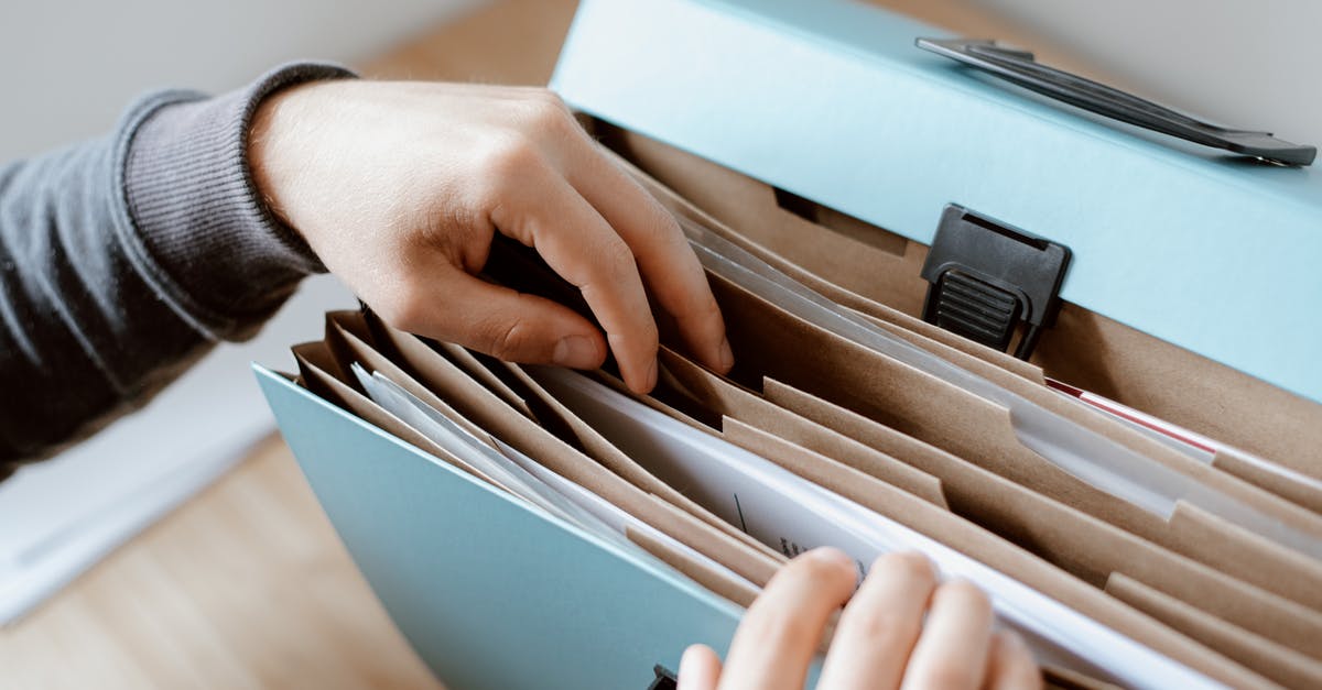 Would my fingerprints still be on file from a 2013 application? - Person choosing document in folder Would my fingerprints still be on file from a 2013 application? - Person choosing document in folder
