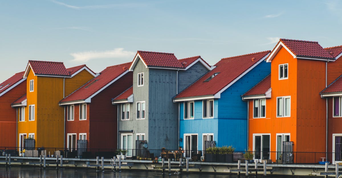 Would the Netherlands refuse entry for a Schengen visa issued by the Italian embassy? - White and Brown Concrete Houses Beside Body of Water