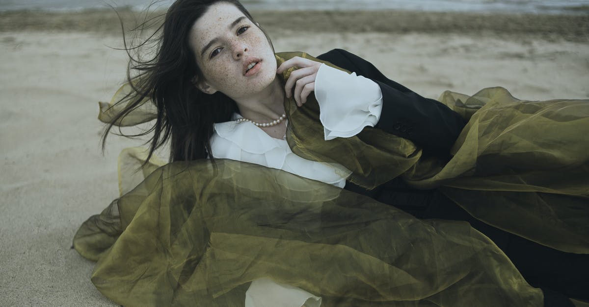 Would you have to remove your jacket for the X-ray machine if you're not wearing anything underneath? - Brunette Woman in White Shirt Lying on Beach Would you have to remove your jacket for the X-ray machine if you're not wearing anything underneath? - Brunette Woman in White Shirt Lying on Beach