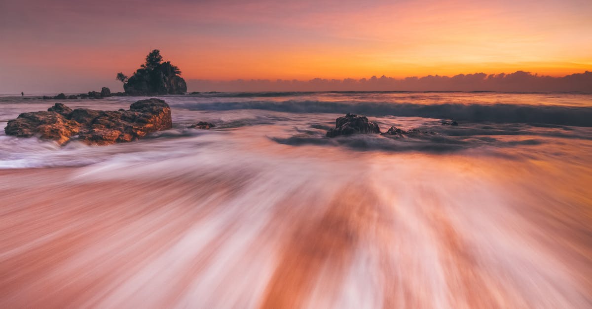 Yogyakarta to mount Merapi by scooter, possible? - Stormy sea with fast water flow on beach at sunset Yogyakarta to mount Merapi by scooter, possible? - Stormy sea with fast water flow on beach at sunset