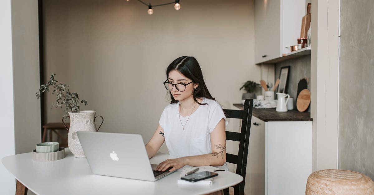 You can't visit the Schengen area if you don't study nor work? - Focused young businesswoman using laptop at home You can't visit the Schengen area if you don't study nor work? - Focused young businesswoman using laptop at home